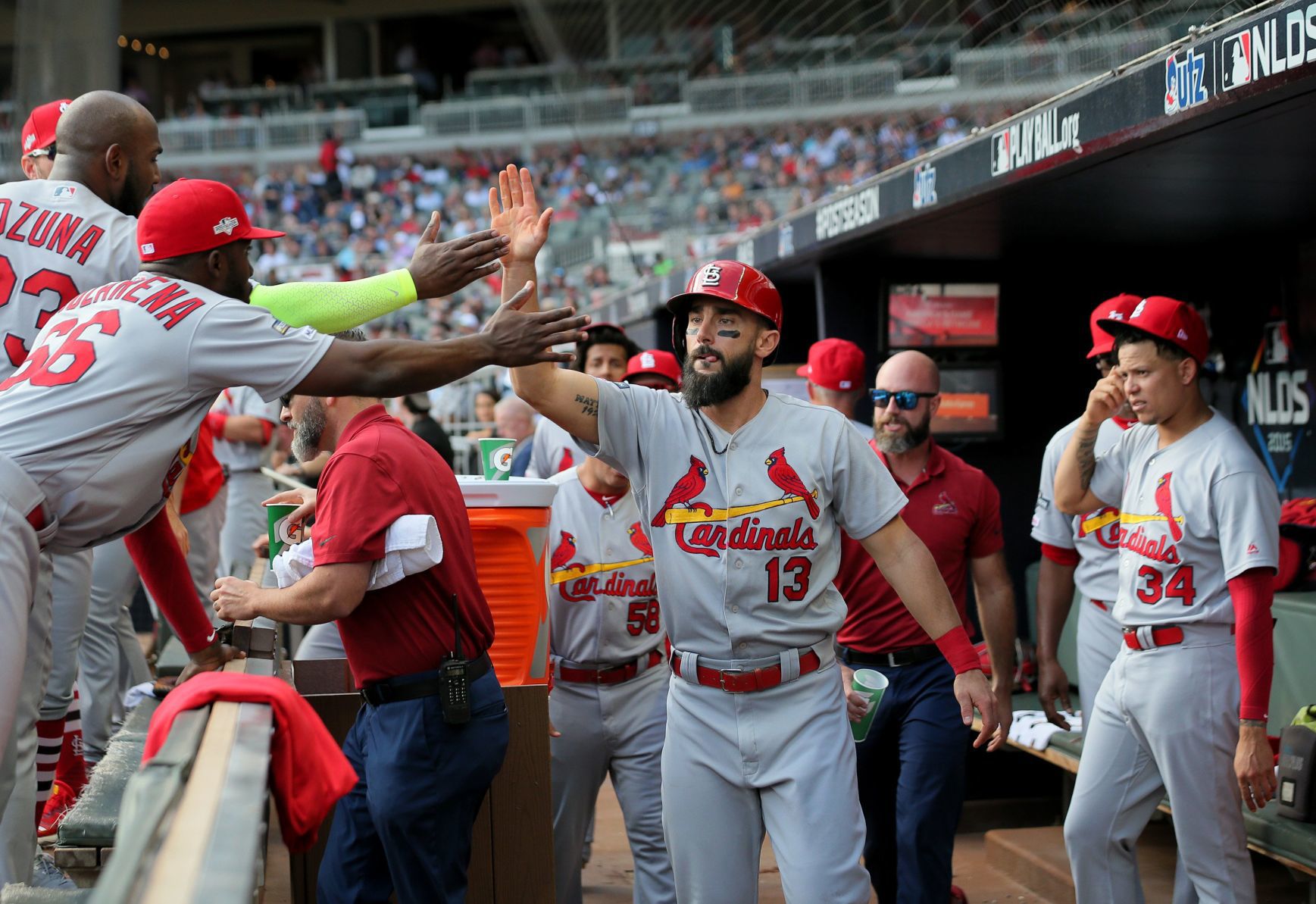 Carpenter gets congrats after scoring in NLDS Game 5 vs. Braves